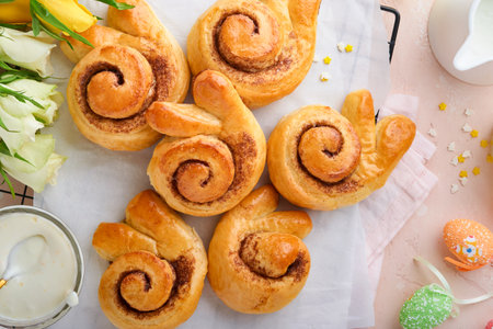 Easter breakfast Holliday concept. Easter bunny buns rolls with cinnamon made from yeast dough with...