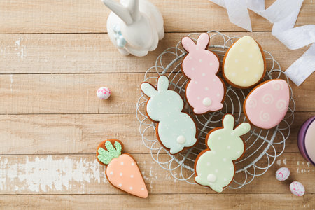 Easter homemade gingerbread rabbits, carrots, chickens and eggs icing cookies. Festive holiday sweet food concept. Easter baking or decoration idea. White background, holiday concept with copy spaceの写真素材