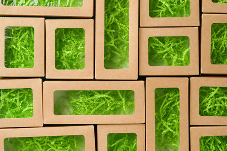 Green Friday background mock up. Sale Tag on green background. Paper shopping boxes and green tag. Environmentally friendly shopping idea, useful things on sale. Reducing excessive consumption.の写真素材