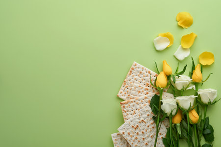 Passover celebration concept. Matzah, kosher red wine, walnut and spring white and yellow rose...