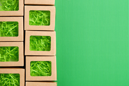 Green Friday background mock up. Sale Tag on green background. Paper shopping boxes and green tag. Environmentally friendly shopping idea, useful things on sale. Reducing excessive consumption.の写真素材