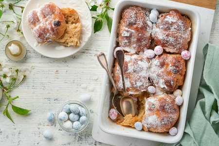 Easter Hot cross buns. Traditional Easter treats cross buns with raisins, butter, chocolate candy...