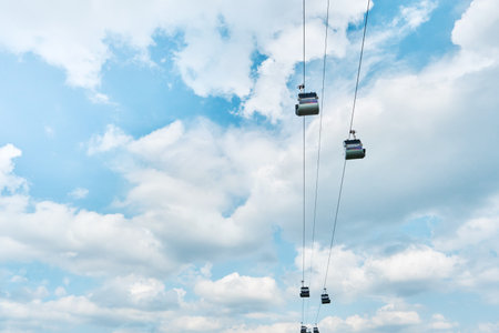 Funicular cabin or Cable car on blue sky clouds background. Sky lift. Cable transportation connects.の写真素材