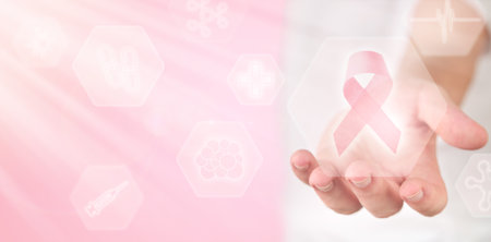 Pink Breast Cancer Awareness Ribbon. Man hand showing holographic screen icon with lighting pink ribbon Breast cancer awareness, October Pink or world cancer day. Science Medical technology. Mock up.の写真素材