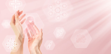 Pink Breast Cancer Awareness Ribbon. Female hand showing holographic screen icon with lighting pink ribbon Breast cancer awareness, October Pink or world cancer day. Science Medical technology.の写真素材