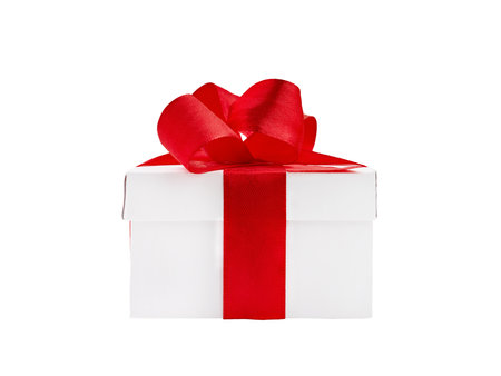 One white gift box with red bow from satin ribbon on white isolated background with clipping path. Element for design.の写真素材