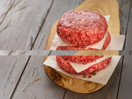 Stack of fresh raw burger patty or ground beef meat burger steak cutlets on dark wooden background.の写真素材