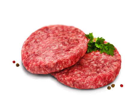 Raw burger patty. Stack of fresh raw burger patty or ground beef meat burger steak cutlets isolated on white background with clipping path. Design element.の写真素材