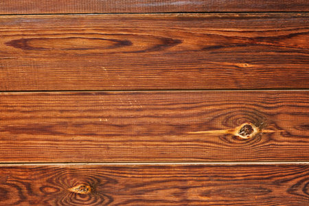 Brown distressed rustic wood grain with twig imperfections and scratches. Overhead view of old dark brown wooden table. Texture or abstract background. Place for text.の写真素材