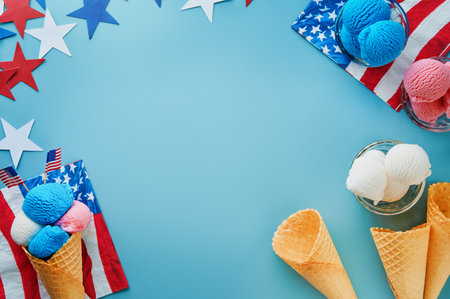 4th of July Holiday background. Colorful ice cream cone with red, white and blue scoops patriotic colors flavors stars and flags on blue background. Top view. Happy Independence Day concept. Mock up.の写真素材
