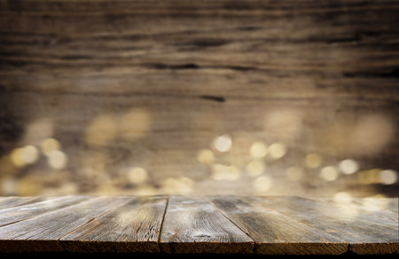 Empty rustic wooden table background. Old wood table with dark blurred background. Mock up.の写真素材
