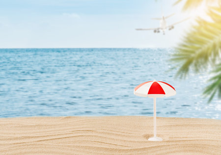 Summer relax frame. Sunny beach with sun lounger, sun umbrella, plane flying away and palm trees leaves. Summer Holidays vacation background. Tourism, vacation and holidays concept. Designの写真素材