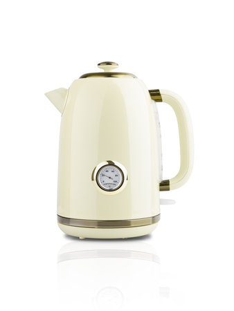 Tea kettle retro in ivory or beige and gold color with stainless steel accents isolated on white background with clipping path. Can be used for self design. Element for designの写真素材