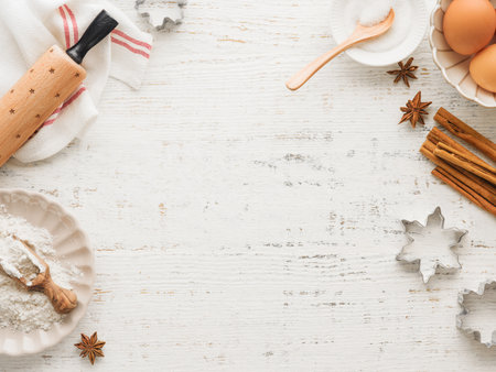 Culinary background with Ingredients for cooking Christmas baking on old white wooden background table. Top view. Christmas holiday kitchen background. Design element.の写真素材