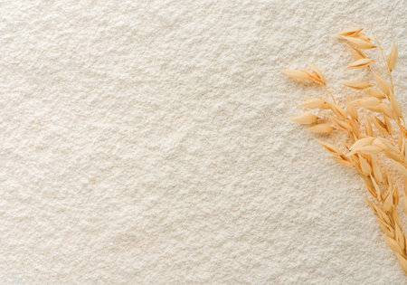 Oat flour textured background with ears and space for text. Close up, directly above.の写真素材