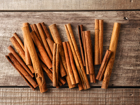 Cinnamon sticks spice on rustic wooden table background. Top view. Design element. Selective focus.の写真素材