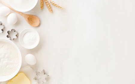 Culinary background with Ingredients for cooking Christmas baking on old white wooden background...