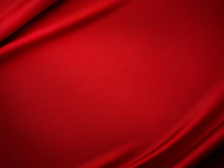 Beautiful red silk satin background. Luxury background with copy space for text, design. Flat lay, top view.の写真素材