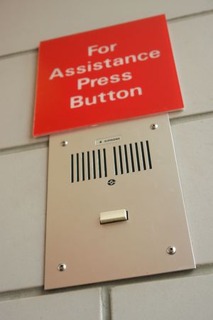For assistance press button sign and box with a button