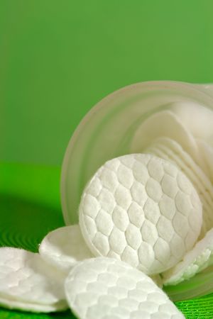 Cotton pads with green backgroundの写真素材