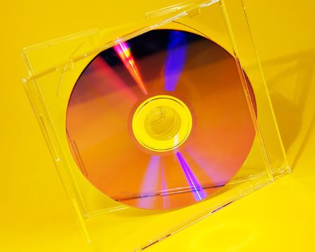 Cd inside cd case on yellow background