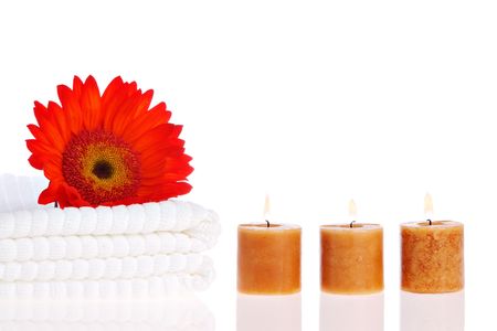 Candles, flower, and white towelsの写真素材