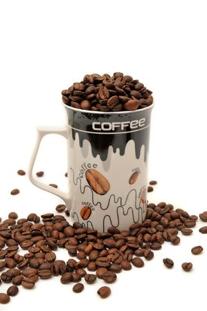 Coffee beans in the glass on white backgroundの写真素材