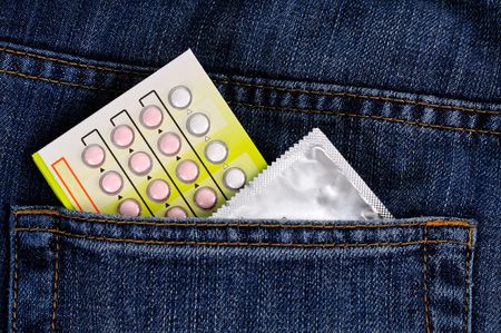 Condoms and contraceptive pills within back pocketの写真素材