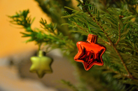 Star-shaped baubles on a Christmas tree