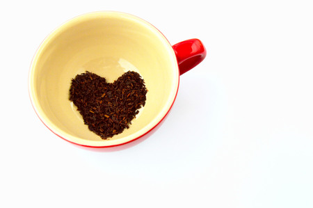 Heart, made of Rooibos tea leaves, in a mug.の写真素材