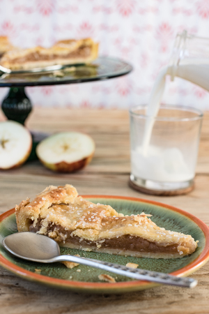 Apple pie, home made cake and the glass of milkの写真素材