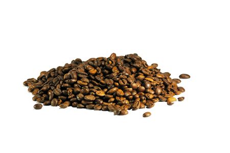 brown coffee grains on a white backgroundの写真素材