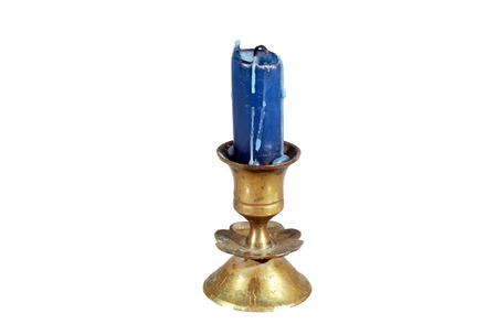 candle blue candle in a brass candlestickの写真素材