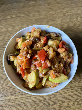 Delicious Georgian Ajapsandali: vibrant vegetable stew with eggplant, peppers, and herbs.の写真素材