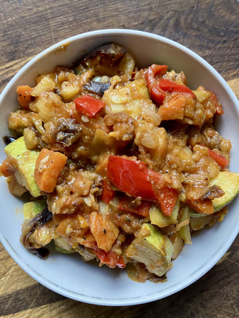 Delicious Georgian Ajapsandali: vibrant vegetable stew with eggplant, peppers, and herbs.の写真素材