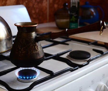 Turk with coffee on the gas stove.