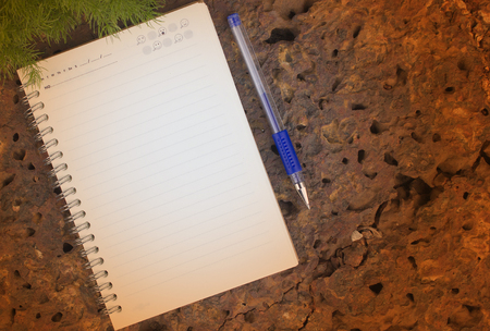 Note book on stone backgroundの写真素材