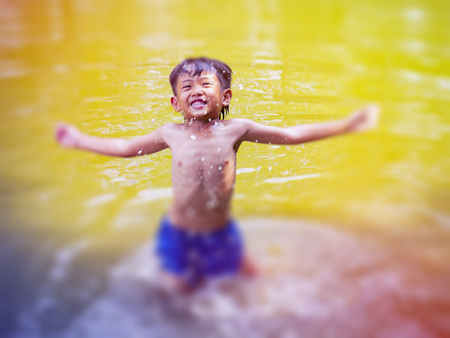 The boys swim and have fun.の写真素材