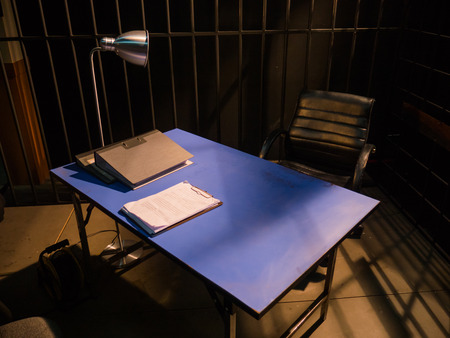 Dark Interrogation Room with Chairs and Table a disturbing Situationの写真素材