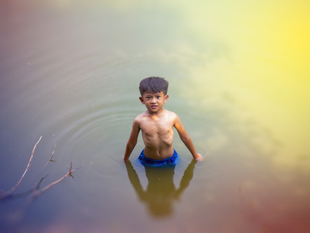 The boys swim and have fun.の写真素材