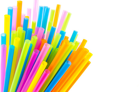 Closeup view of colorful drinking straws isolated on white backgroundの写真素材