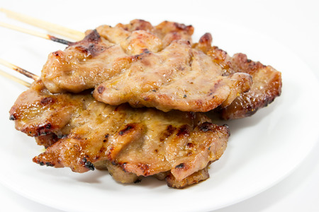 Traditional Thai style grilled pork isolated on white backgroundの写真素材