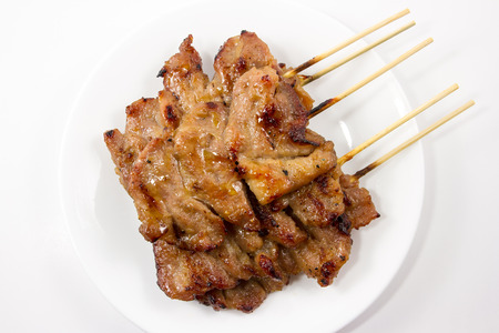 Traditional Thai style grilled pork isolated on white backgroundの写真素材