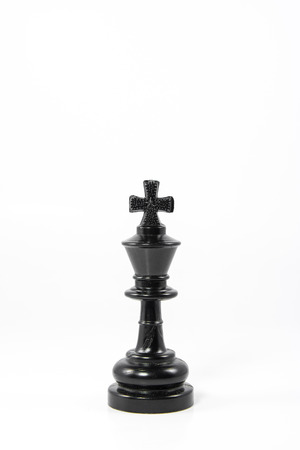 Black chess king isolated on white backgroundの写真素材