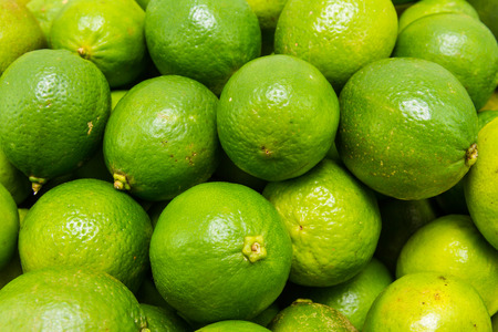 close up view of green lime citrus fruitの写真素材