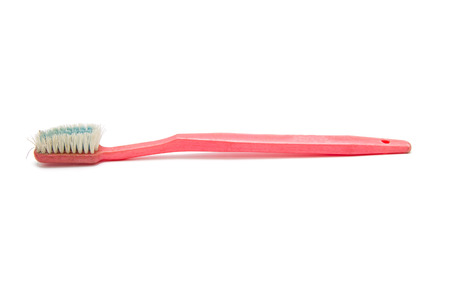old toothbrush isolated on white backgroundの写真素材