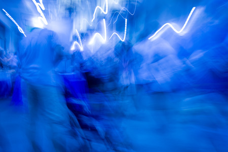 people walking in modern office, abstract blurred motionの写真素材