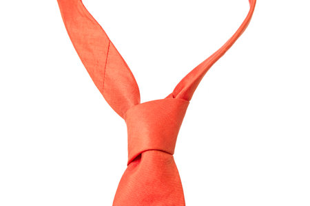 plain orange business neck tie isolated on white backgroundの写真素材