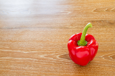 sweet pepper on wooden tableの写真素材