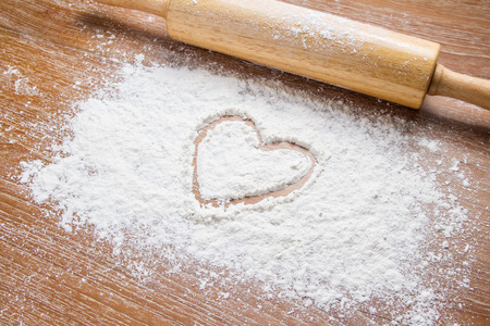 rolling pin on table with flourの写真素材